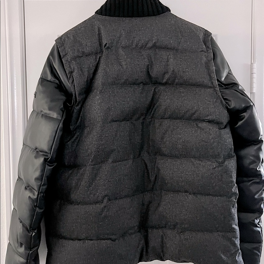 Black DKNY Puffer/Bomber jacket. This jacket is well insulated and element ready